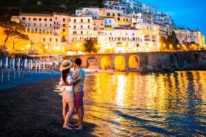Family on sunset in Amalfi town in Italy