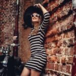 Fashion woman in dress with stripes.