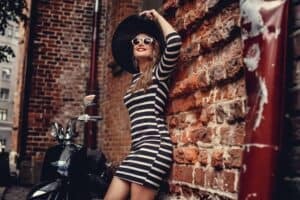 Fashion woman in dress with stripes.