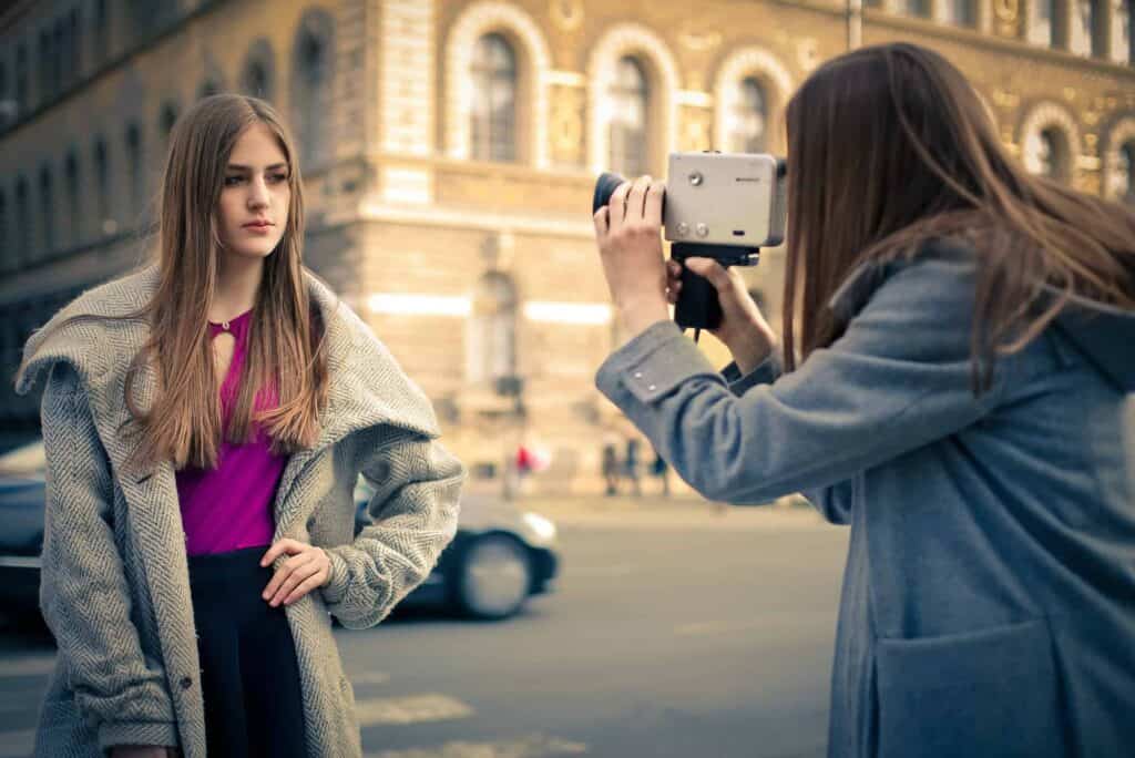 Girl filming another girl