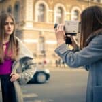 Girl filming another girl