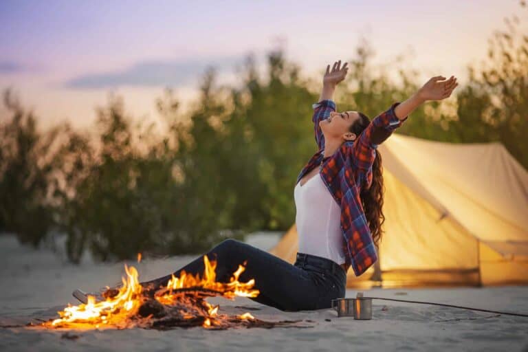 Tourist Woman in the Camp Near Campfire